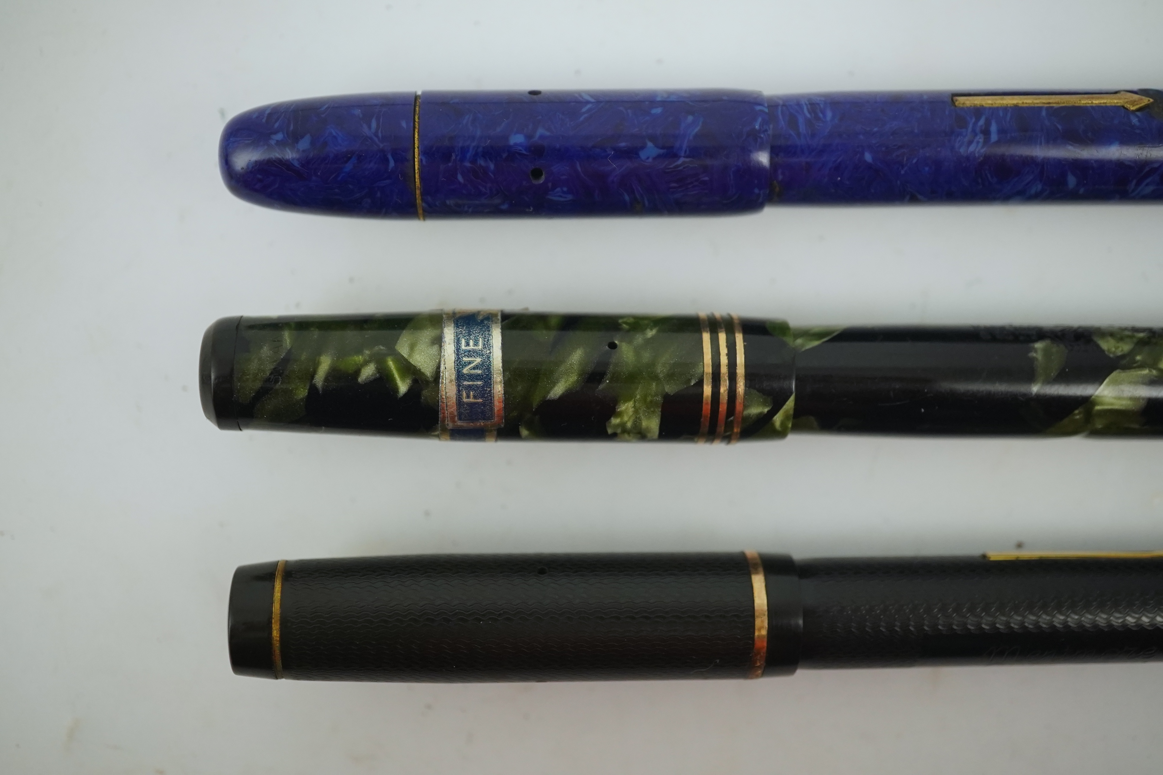 A Wyvern Perfect, No. 81, a Mentmore Autoflow fountain pen and a Mabie Todd Swan fountain pen. Condition - fair to good